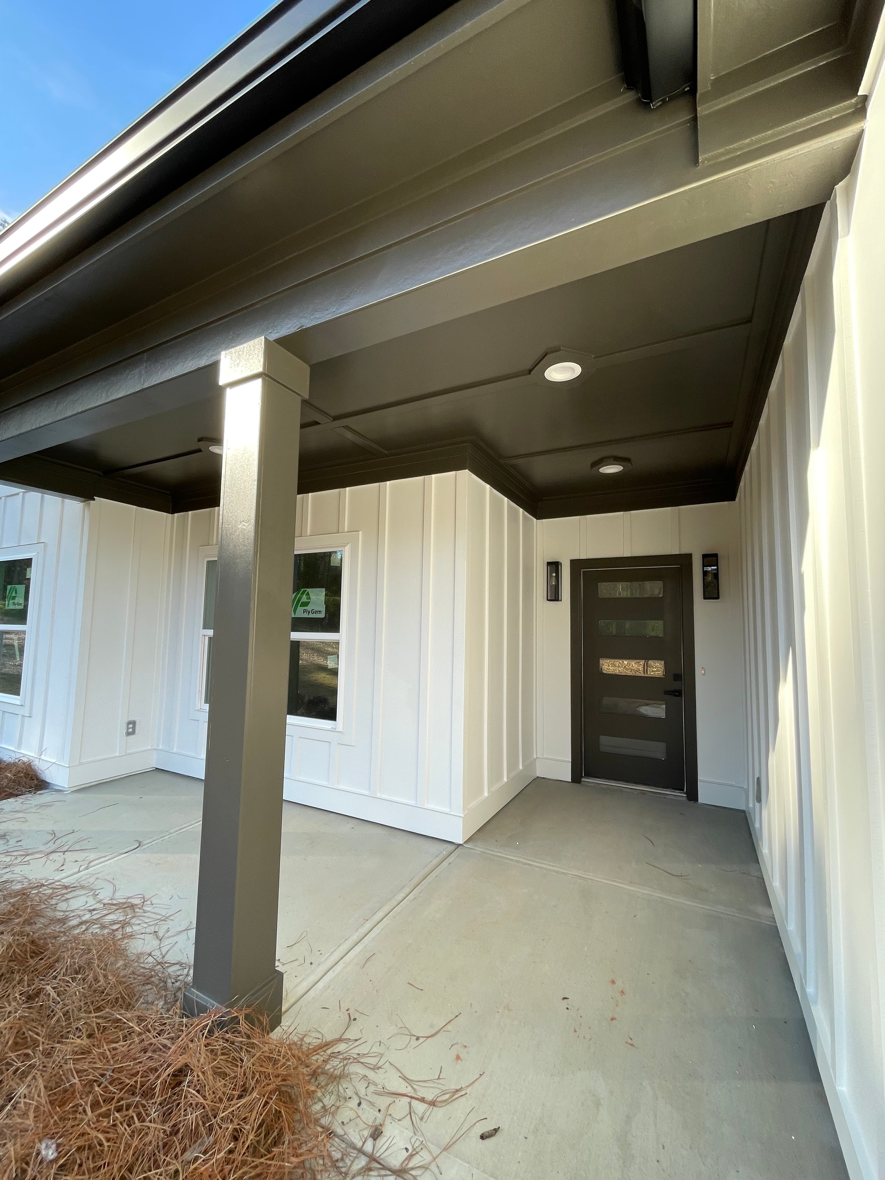 Home front entry with white and taupe painted exterior