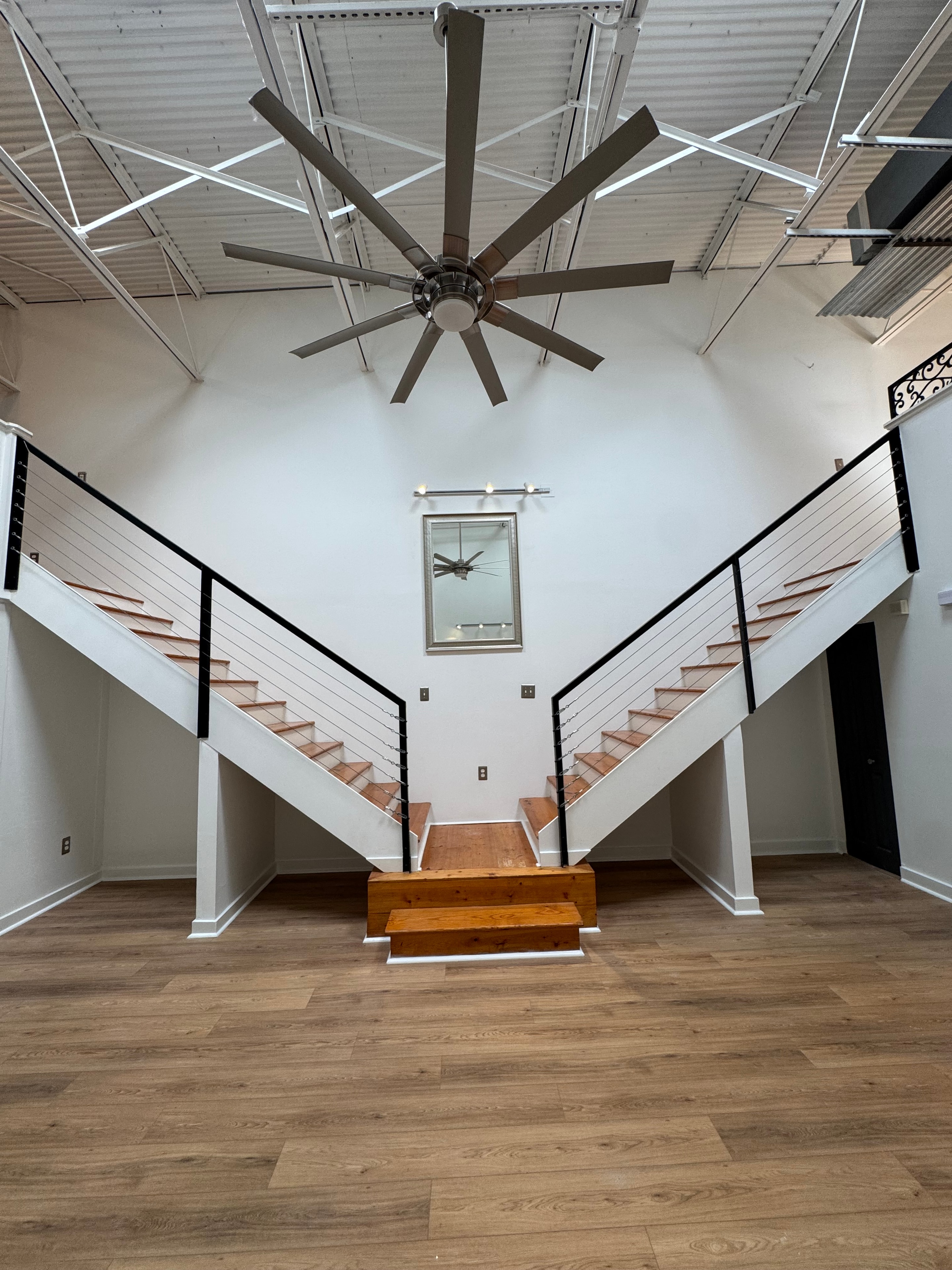 Modern interior staircase with white walls and wood floors