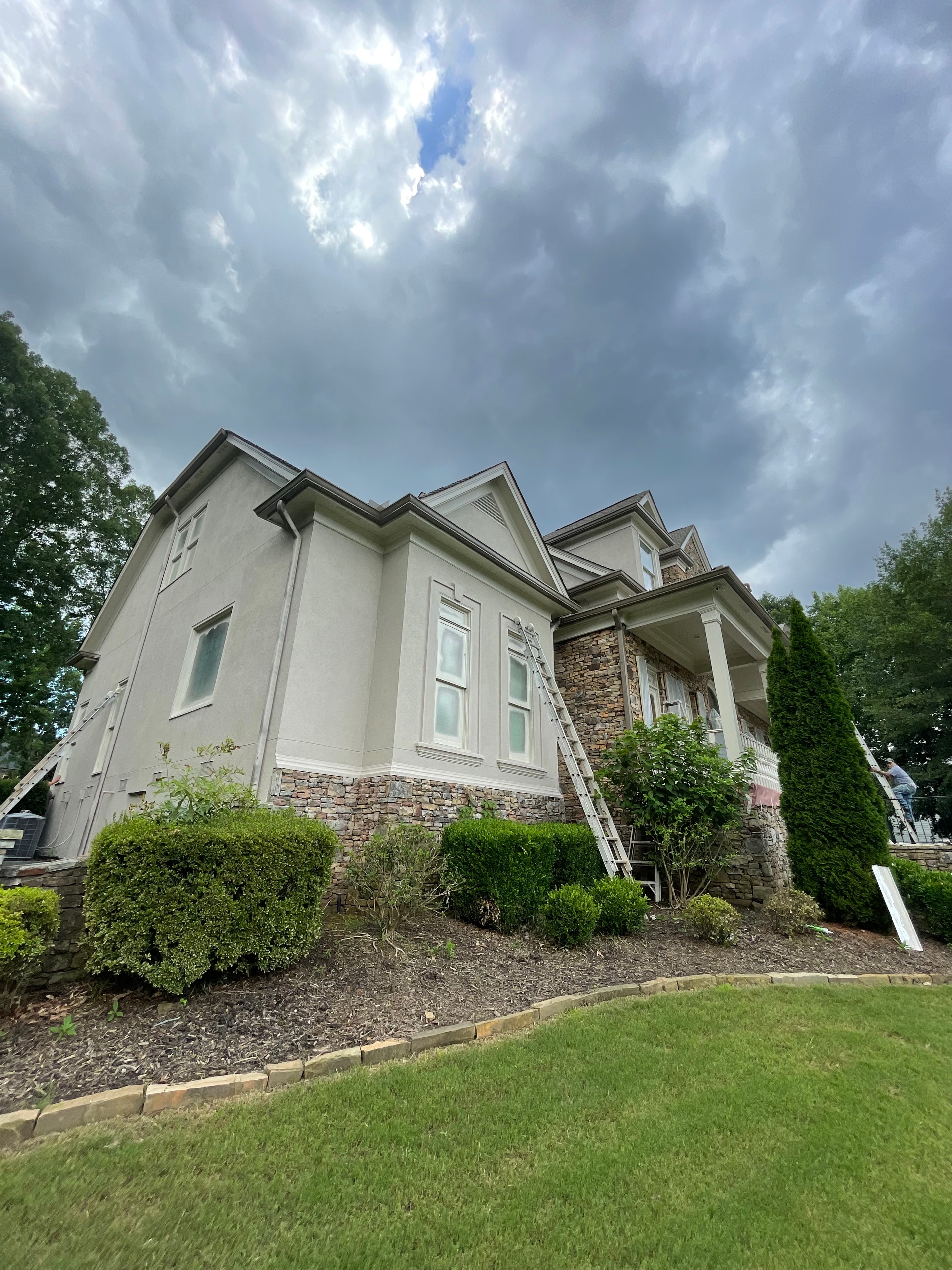 Suburban home with gray siding and white trim